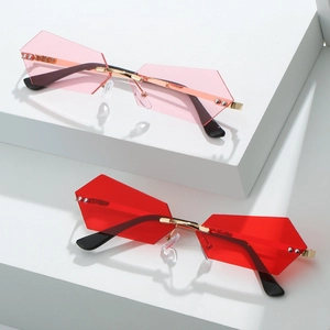 Frameless geometric sunglasses with gradient lenses and gold metal frames on white steps