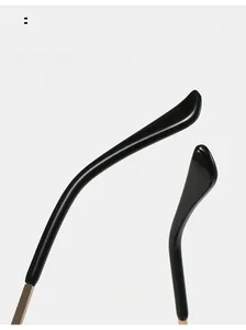 Detail of gold metal temples with curved black tips for comfortable sunglasses wear