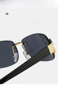 Detailed close-up of rimless square sunglasses with gold V-shaped metal hinge and wide temple