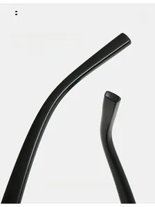 Macro detail of ergonomic curved mirror legs on rimless square Y2K sunglasses