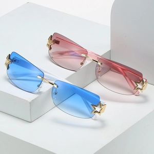 Y2K rimless square sunglasses with gradient lenses and gold star accents on lenses