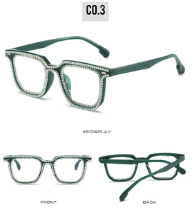 Detail view of square green frames with double rows of sparkling multi-color rhinestones