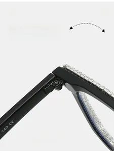 Close-up of metal hinge and clear rhinestones on black square frame glasses with CE mark