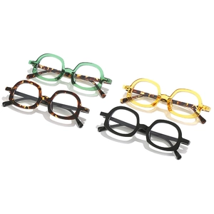 Four vintage square geometric eyeglass frames in diverse colorful patterns and finishes