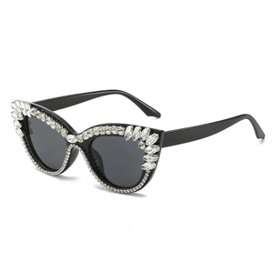 Luxury oversized cat eye sunglasses with shimmering crystals and dark gray lenses