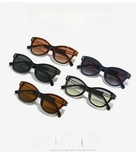 Close-up of cat-eye sunglasses featuring golden chain temples in various chic colors