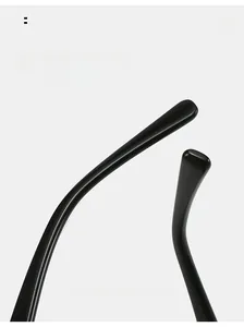Detail shot of ergonomic curved black glossy sunglasses temple for comfortable fit