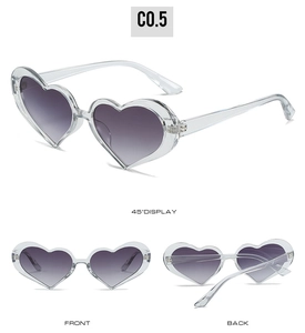 Detailed views of heart-shaped sunglasses with purple gradient lenses and clear frames
