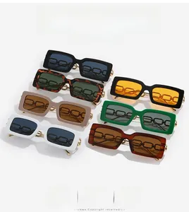 Array of multi-color rectangular sunglasses featuring bold gold chain details on the temples