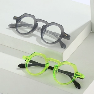 Retro geometric round sunglasses in transparent grey and fluorescent green frames