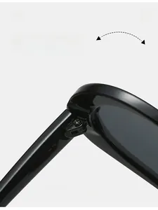 Macro shot of durable metal hinges on classic black heart-shaped candy sunglasses
