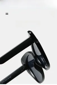 Dettaglio degli occhiali da sole cat eye con numero di modello 9174 sulla montatura nera
