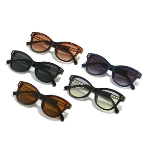 Cat eye sunglasses with gold rivets and chain temples in five assorted frame colors
