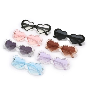 Set of seven candy-colored heart-shaped sunglasses in various gradient fashion tints