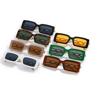 Collection of square sunglasses in seven colors featuring vintage gold chain temples