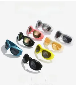 Flat lay of oversized steampunk sunglasses in multiple colors with sleek wrap frames