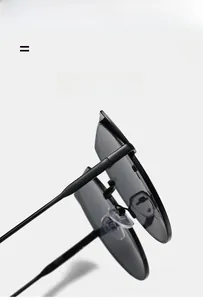 Detail of irregular metal hinges and soft silicone nose pads on black sunglasses