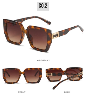Detail of tortoise shell sunglasses frame with gold hardware and UV400 CE markings