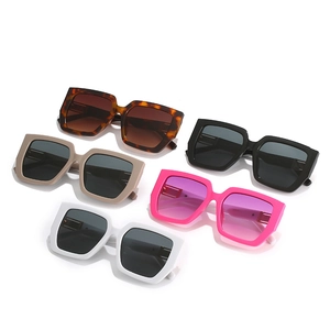 Five pairs of oversized square sunglasses in assorted colors on white background