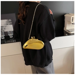 Golden shell-shaped mirror evening bag with elegant metal chain and top ball clasp