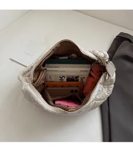 Detail of quilted tote interior with stripes lining and high capacity storage space