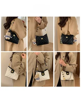 Quilted crossbody bag featuring flower chain strap and cute bear pendant detail