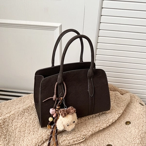 Vintage dark brown textured faux suede shoulder bag with a cute poodle plush charm