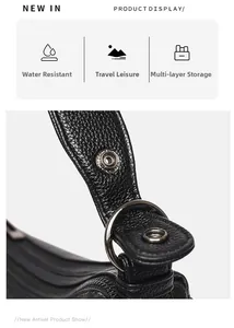 Detail of waterproof black pebble leather shoulder bag with multi-layer storage and gunmetal hardware