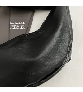 Detail of black dumpling bag showing high-quality pebbled leather texture and soft material