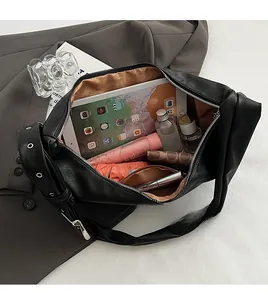 Top view of large black oil wax leather hobo bag showing spacious interior and storage