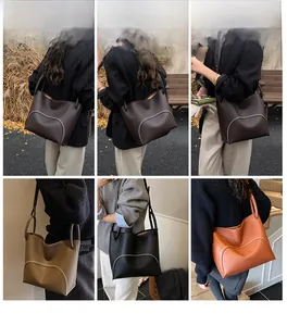 Detail showing high-quality soft leather texture and multi-color options of the tote bag