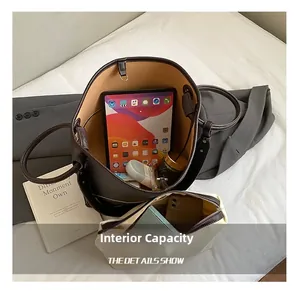 Interior view of brown leather tote bag with canvas insert showing spacious capacity