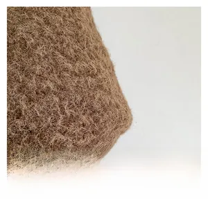Close-up of premium brown faux fur fabric texture for a plush bucket bag detail
