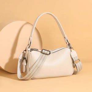 Beige faux leather crossbody bag with dual straps and elegant geometric woven wide shoulder strap