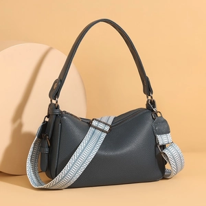 Litchi pattern dark blue leather shoulder bag with wide geometric strap and gunmetal hardware