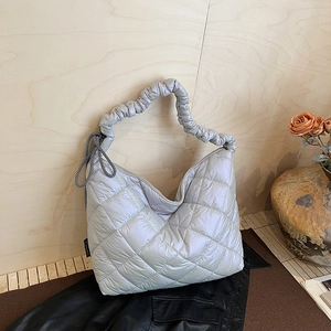 Silver quilted padded hobo bag with ruched handle and puffer texture for women