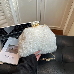 Elegant white faux shearling shoulder bag with gold chain and large pearl clasp