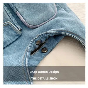 Detail view of denim bag featuring durable snap buttons and decorative zipper pockets