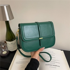 Retro dark green square crossbody bag with gold hardware and minimalist flap design