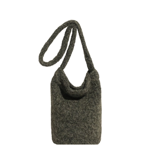 Dark grey plush knit bucket bag with curly faux fur texture and long shoulder strap