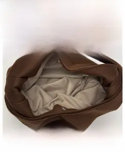 Detail view of the double magnetic silver buckles and beige fabric lining on a felt tote bag