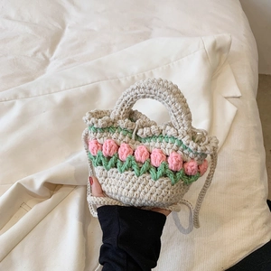 Handmade crochet tulip tote bag with pink flower patterns and woven shoulder strap