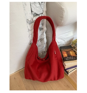 Detail of the high-quality dark red felt hobo bag showing its thick woolen texture