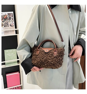 Detail showing plush brown faux fur texture and leather flap on crossbody bag