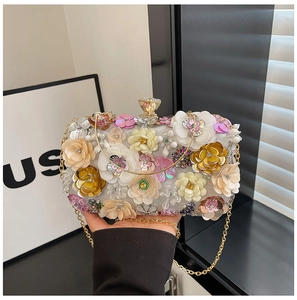 Detailed macro shot of 3D floral embroidery, sequins and crystals on this evening clutch