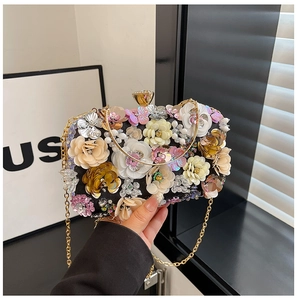 Detail of 3D sequin flower clutch with beaded petals and gold ring handle