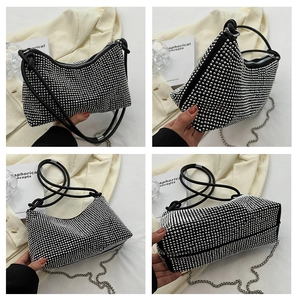 Detail showing the sparkling rhinestones and black knot handle of the shoulder bag