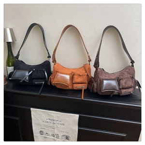 Three vintage multi-pocket shoulder bags in black, caramel and dark coffee suede
