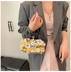 Exquisite evening clutch bag featuring 3D floral petals and sparkling rhinestone details