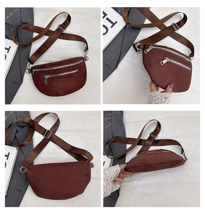 Detail view of dark brown suede chest bag showing silver zippers and wide nylon strap